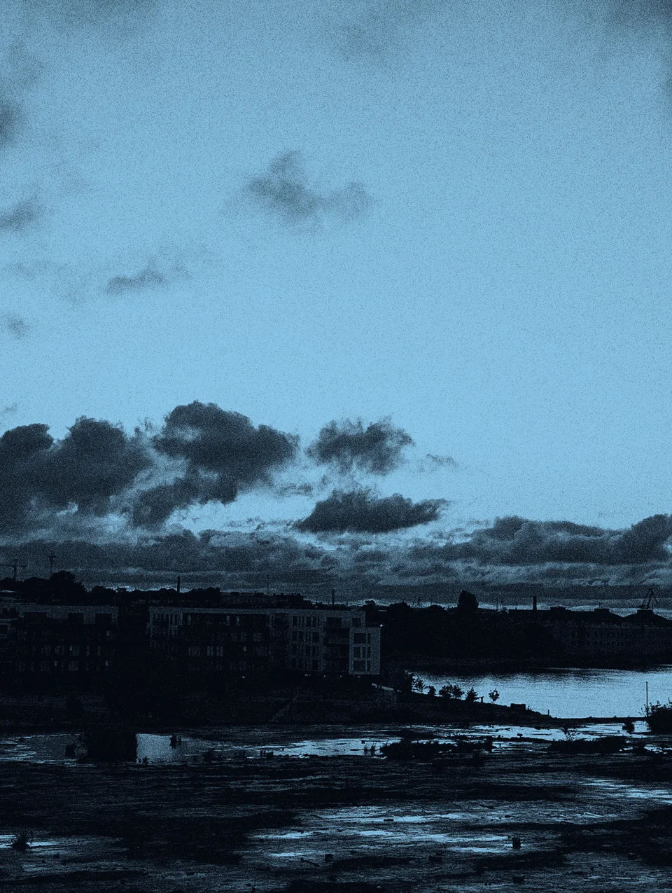 Clouds and sunset light over the harbor.