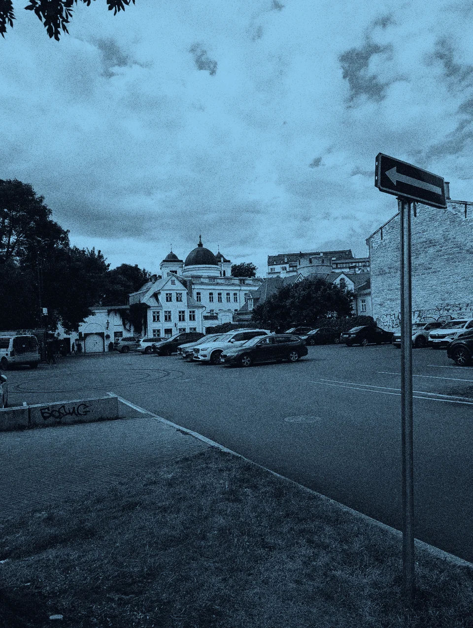 Old town buildings beneath a cloudy sky.