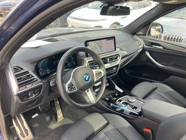 BMW iX3 Impressive — photo 21