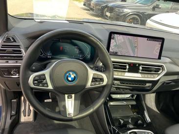 BMW iX3 Impressive — photo 23