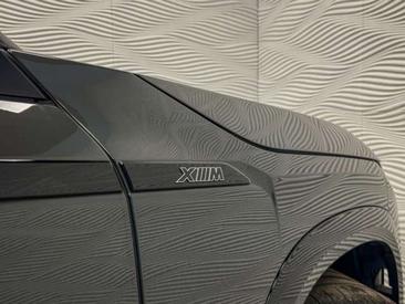 BMW XM 50e — photo 14