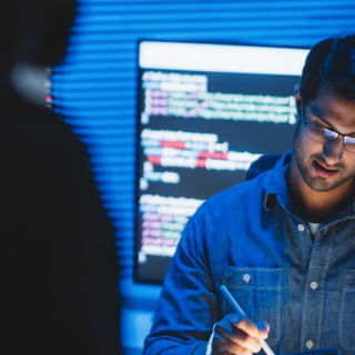 A man working on a tablet device.