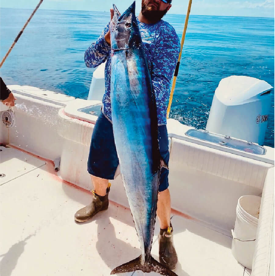 Catch wahoo on charter fishing trip.