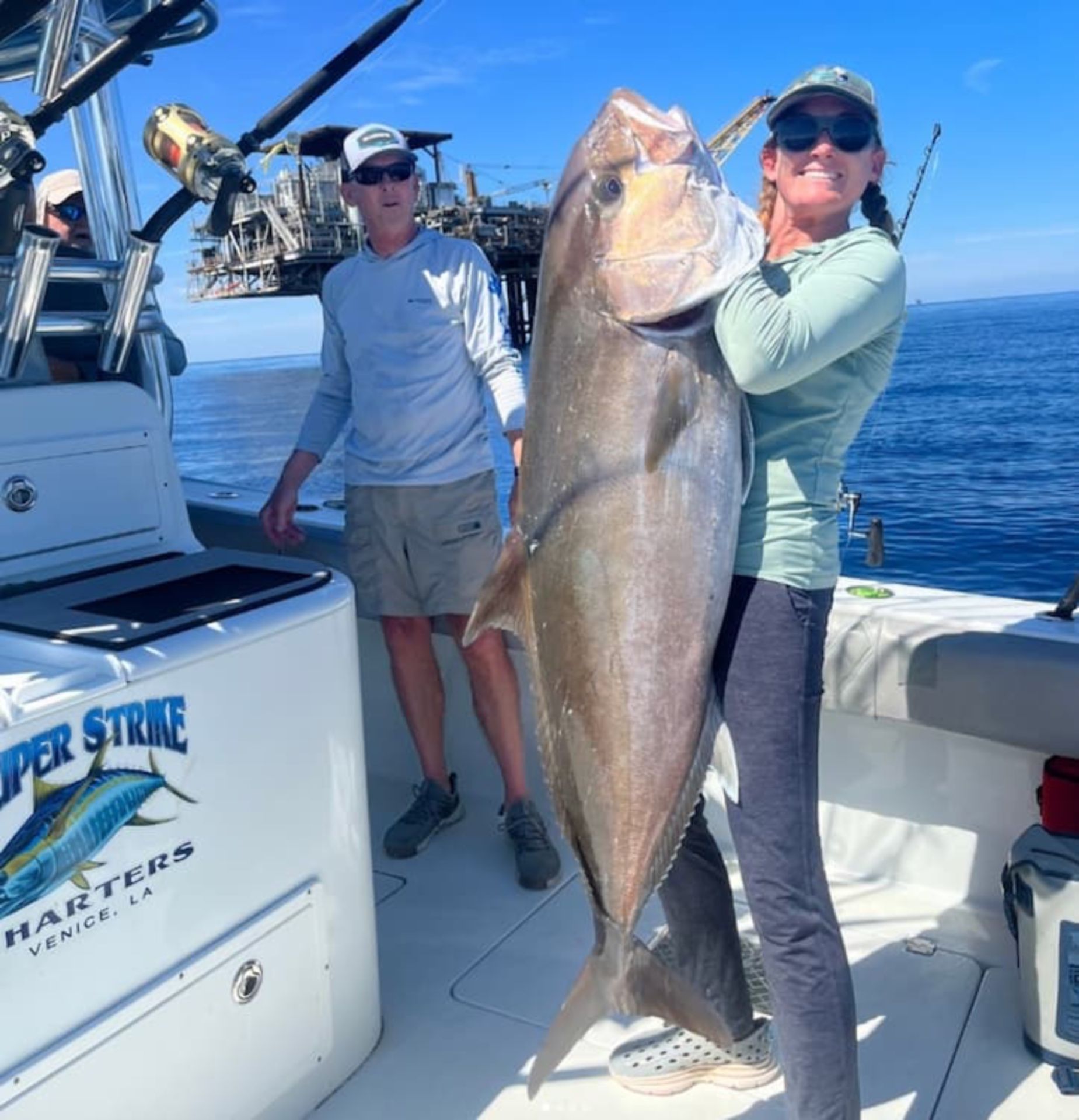 woman-holding-massive-fish.jpg