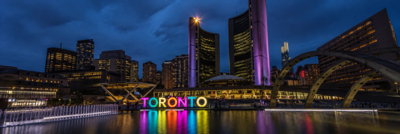 Toronto skyline at dusk representing PTE Core exam preparation for Canadian immigration