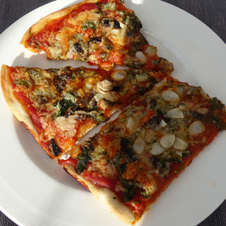 Pizza with mushrooms and kale