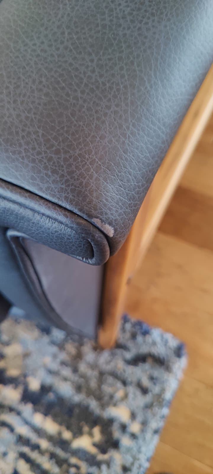 Scuffed and damaged couch arm