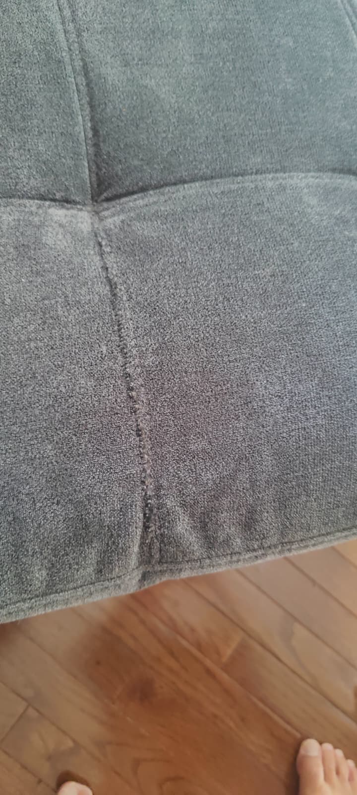Couch with seamlessly repaired fabric