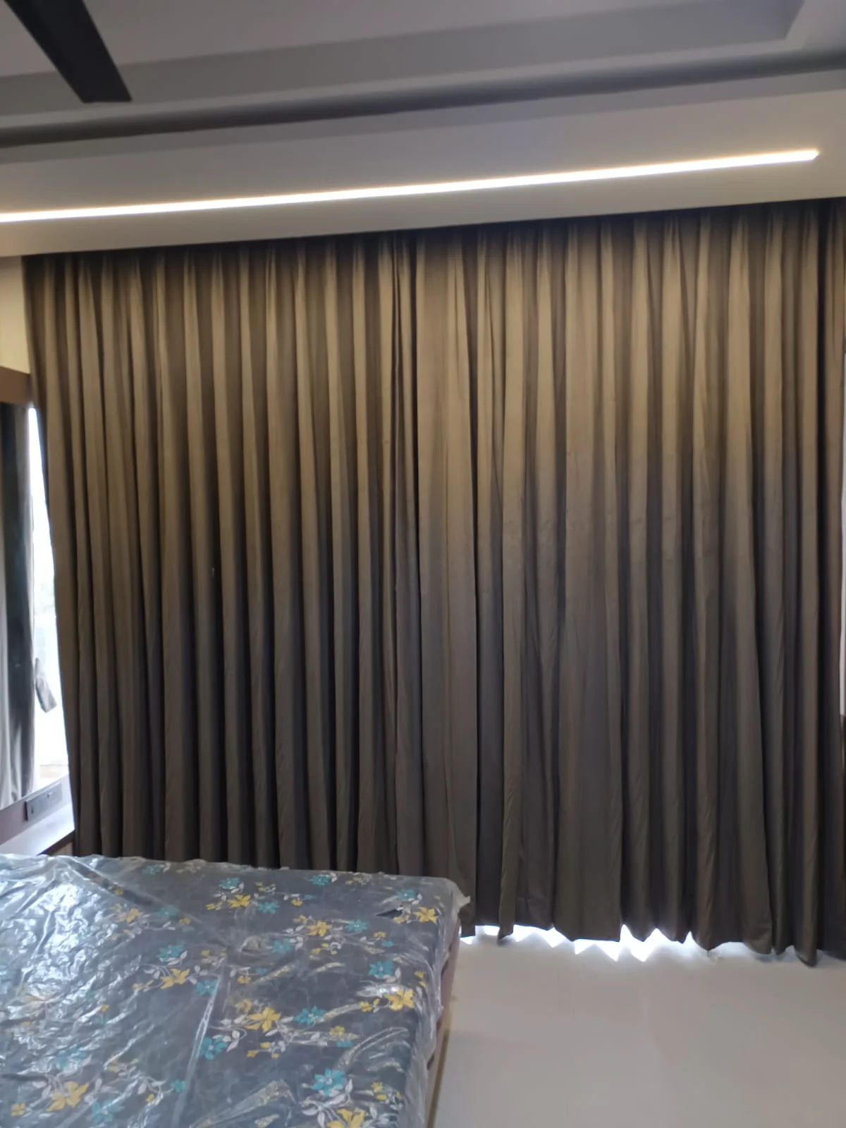 Custom designer velvet curtains and transparent sheer curtains.
