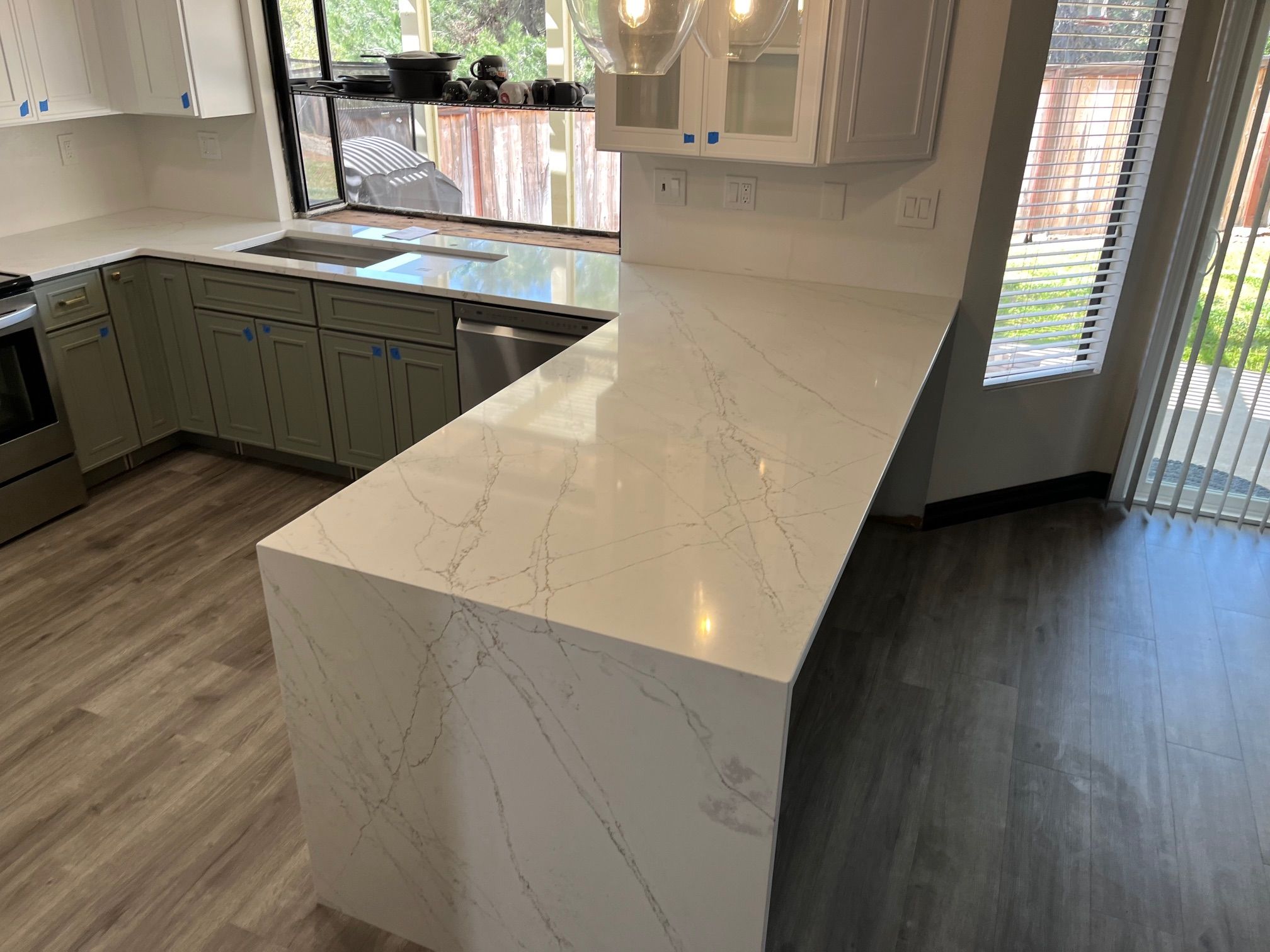 Modern quartz waterfall edge kitchen island