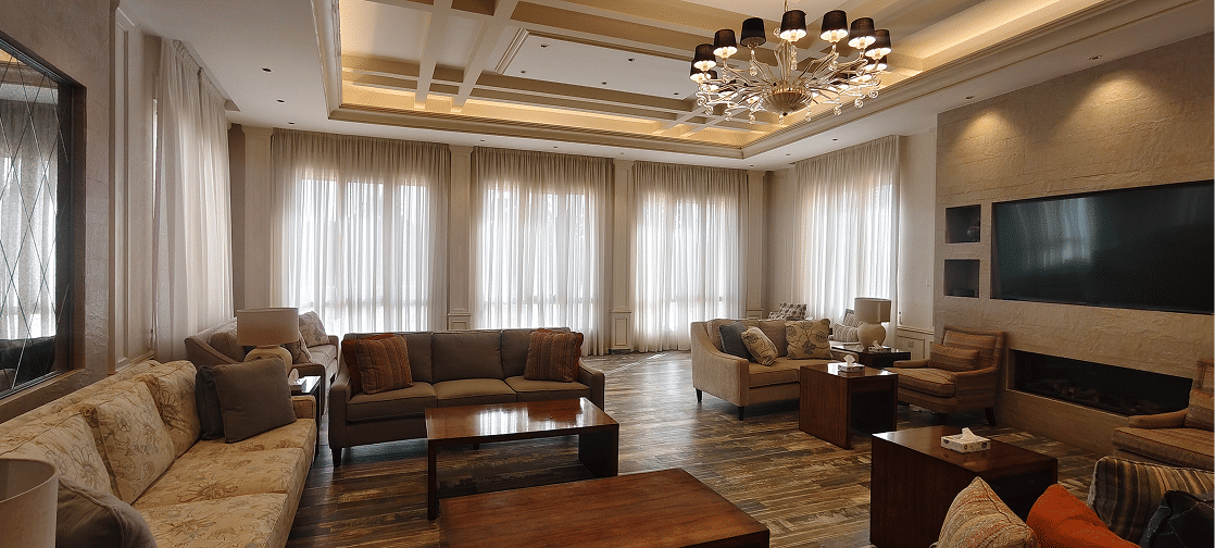 Lengthened curtain drape creating a taller and more luxurious visual finish