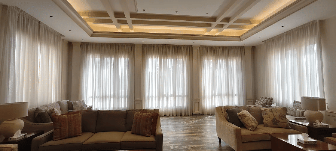 Curtain detail showing precise pleat alignment during curtain refitting