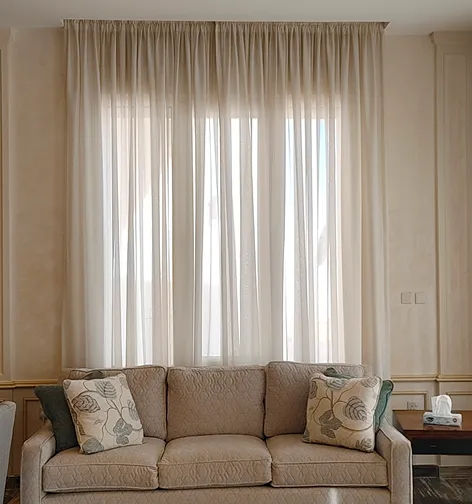 American curtains professionally lengthened and refitted for a floor-to-ceiling finish in Riyadh