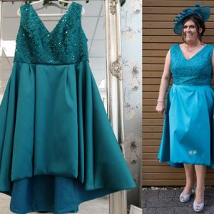 Designer mother of the bride dress. Teal sparkle bodice with high/low micado skirt. Made to measure in Glasgow