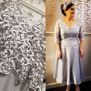 Designer mother of the bride dress. Gun metal embroidered bodice with soft satin skirt. Made to measure in Glasgow