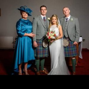 Designer mother of the bride dress. Teale silk micado dress and jacket. Made to measure in Glasgow