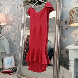 Designer mother of the bride dress. Coral crepe fitted dress with flutter sleeves and hem. Made to measure in Glasgow