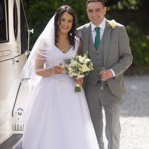 White micado bridal gown, fitted bodice with vneck featuring pleated skirt with pockets. Made to measure in Glasgow