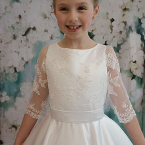 First holy communion dress. Beaded tulle bodice and three-quarter length sleeves with full circular satin skirt. Made in Glasgow