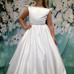 heavy weight satin communion gown with frill cap sleeve and full gathered skirt. Made to measure in Glasgow