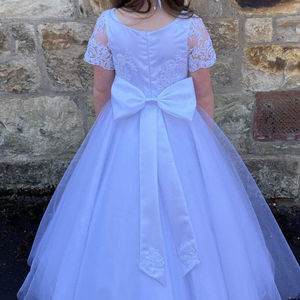 First holy communion dress. Beaded lace tulle skirt communion dress with bow tier detail. Made in Glasgow