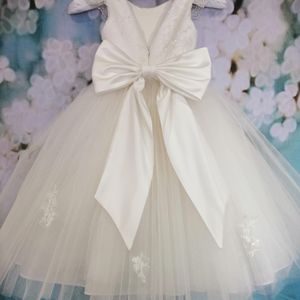 Ivory beaded bodice, cap sleeve with full tulle skirt flower girl dress. Made to measure in Glasgow