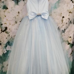 Ice blue satin flower girl dress with gliter tulle skirt and diamonte belt. Made to measure in Glasgow