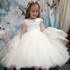 Ivory beaded tulle bodice with sleeve, full tulle skirt flower girl dress. Made to measure in Glasgow