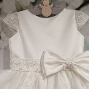 Ivory satin flower girl dress with lace cap sleeve, belt and bow. Made to measure in Glasgow
