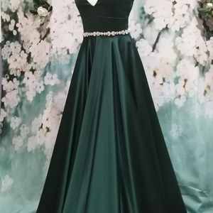 Forest green luxurious satin prom dress. Shaped waist detail and plunging backline. Made to measure in Glasgow