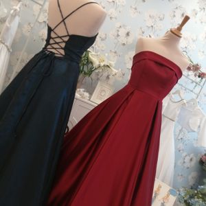Shimmer chiffon prom dress with lace up back & feature split. Claret duchesse satin ballgown with strapless bodice, pleated skirt featuring pockets made to measure in Glasgow