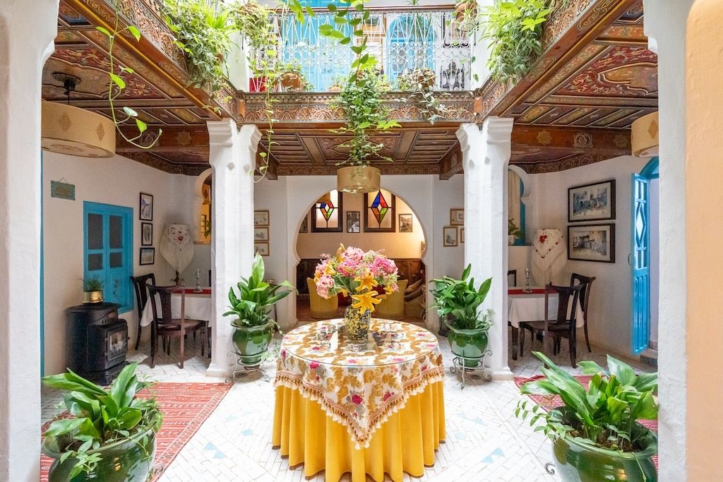 a tiny courtyard with a family-style furnishing at a local riad in Morocco – an example of a family-owned Moroccan accommodation