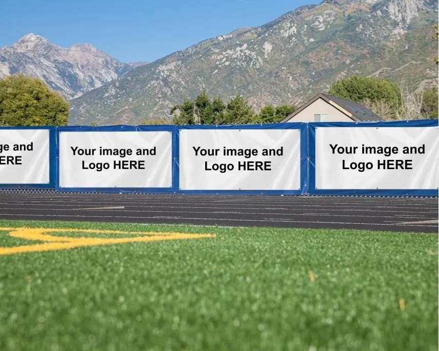 Sponsor banners along the fence of a school football field