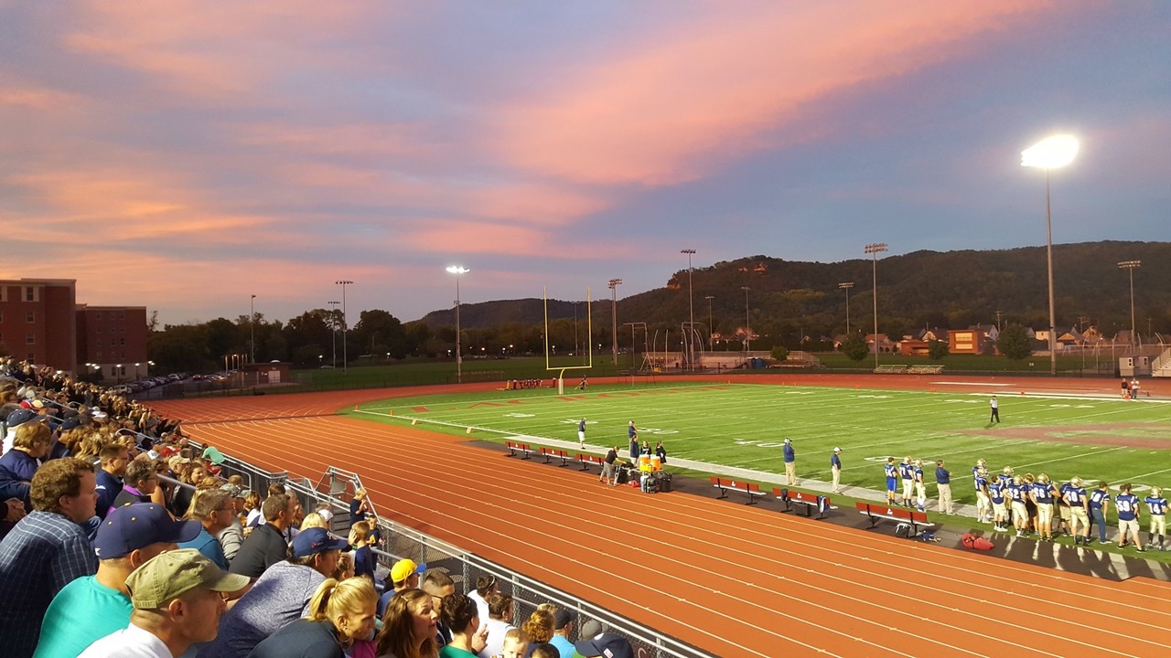 Fans in the stands at a high school football game