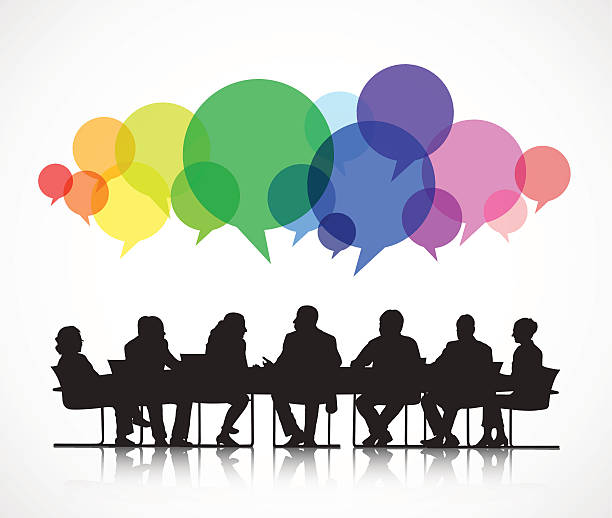 People sitting at a table discussing different ideas and views