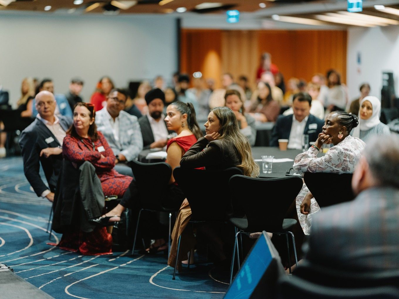 Attendees of the announcement of new advisory panel members listening to opening speeches