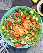 spring chicken, avocado, tomato, and spinach salad