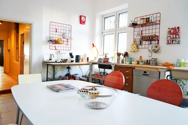 Overview of the bright shared kitchen at KOTEKA coworking space Leipzig