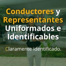 Ekab Shuttles uniformed bilingual driver wearing official ID badge and company polo shirt