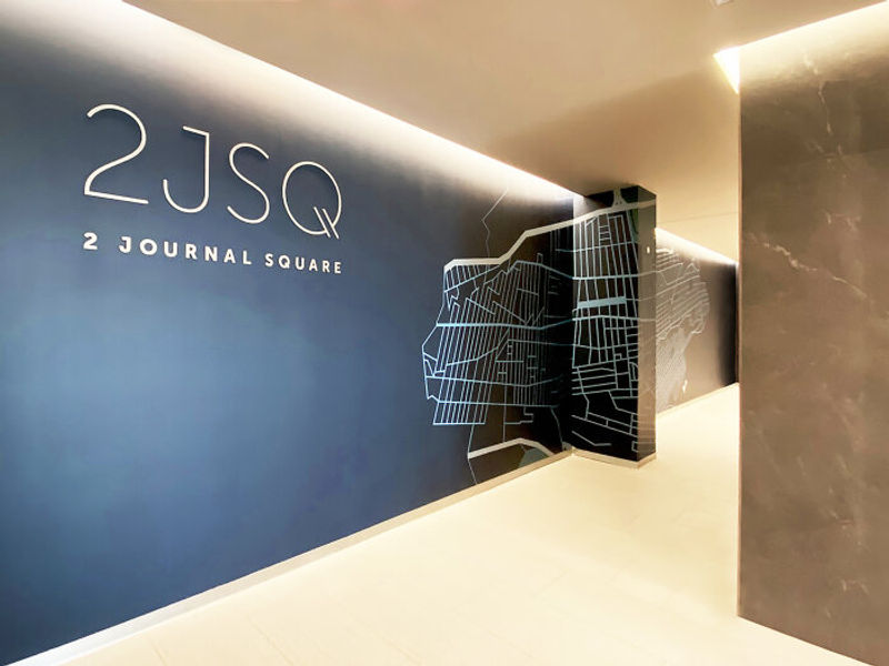 Amplify Wallcovering in the hallway of a corporate office.  We offer four options, shown here is Traffic our heavyweight, self-adhesive vinyl material.