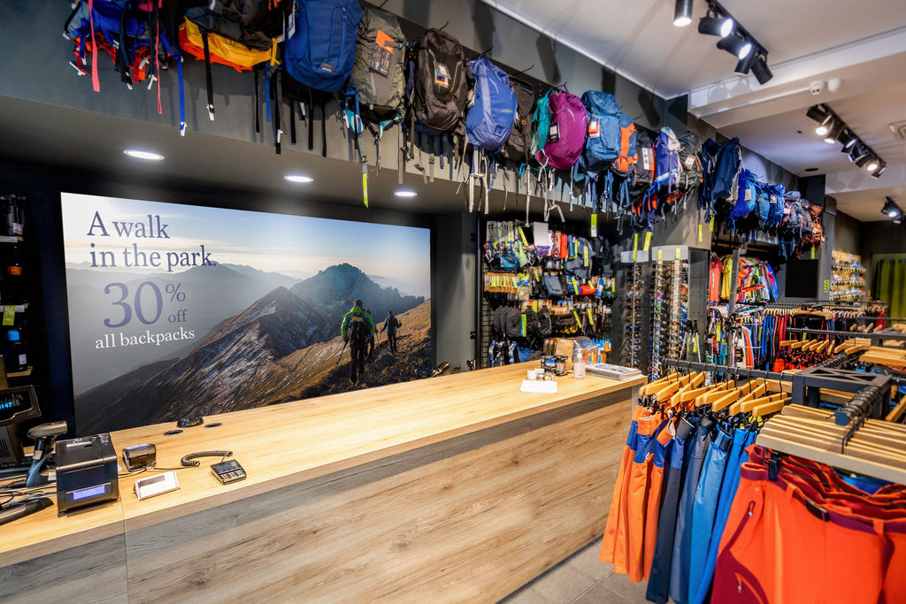 Multiple magnetic wall graphics creating one large promotional graphic for an outdoor retail store