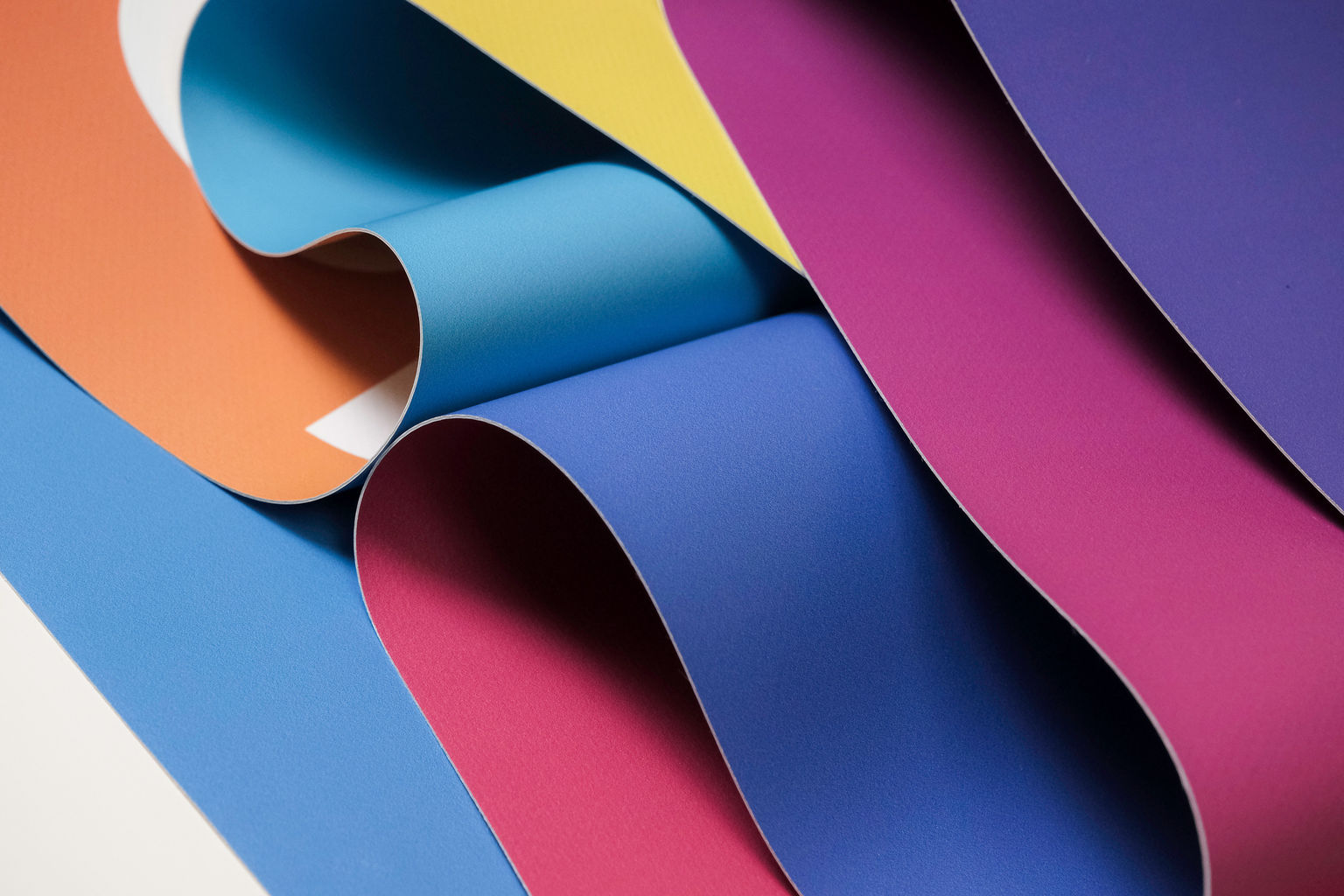 A detailed photo of banner material in multiple vibrant colors