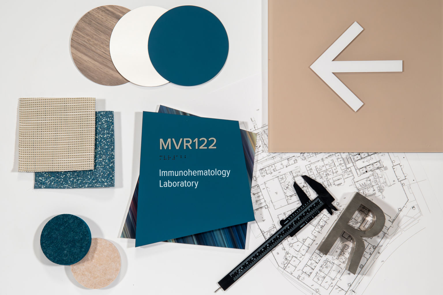 An assortment materials, finishes, design elements mixed with Fusion interior signage.