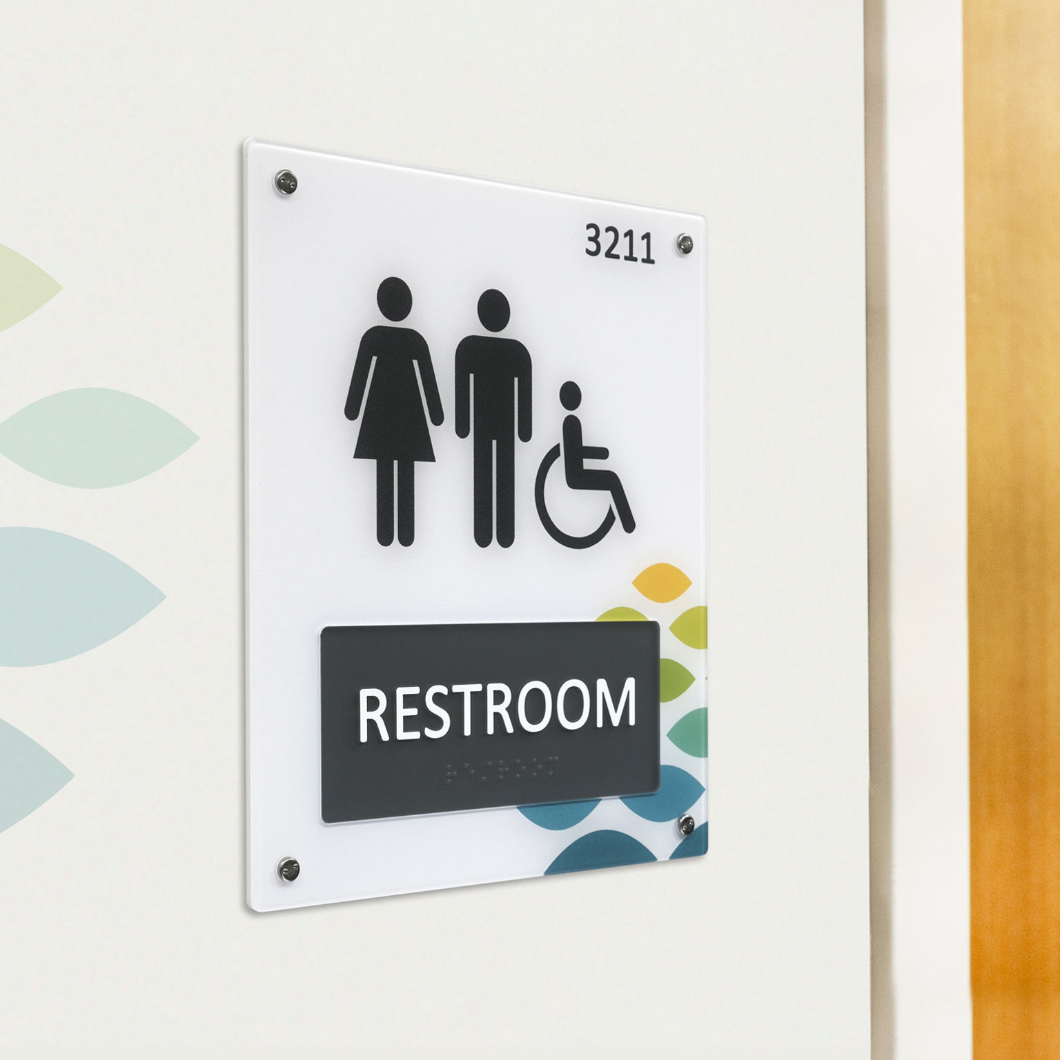 A branded ADA compliant Empath restroom sign installed on a wall outside a restroom.