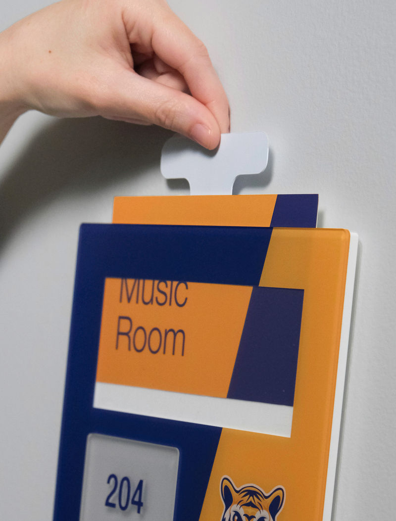 Tamper resistant classroom ID sign with custom graphics plus tamper resistant message insert and one-piece raised lettering and braille