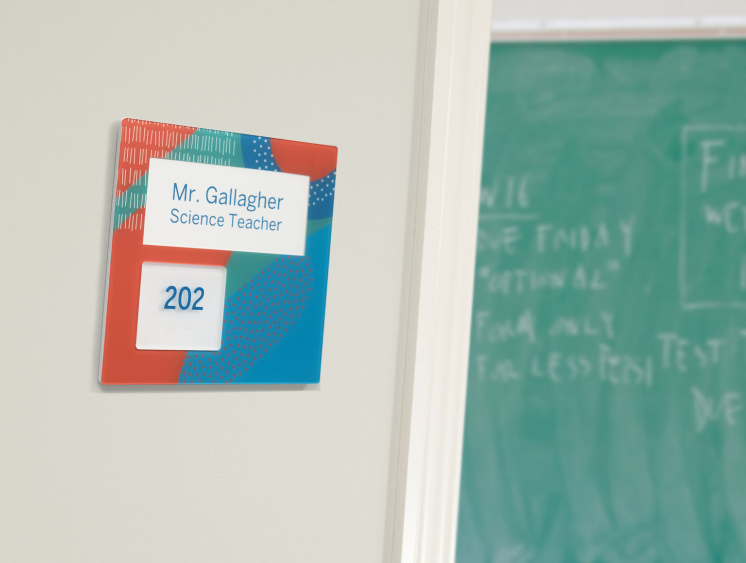 Tamper-resistant ADA compliant room ID sign with custom graphics and relaceable insert for a science teachers classroom in an early education facility.