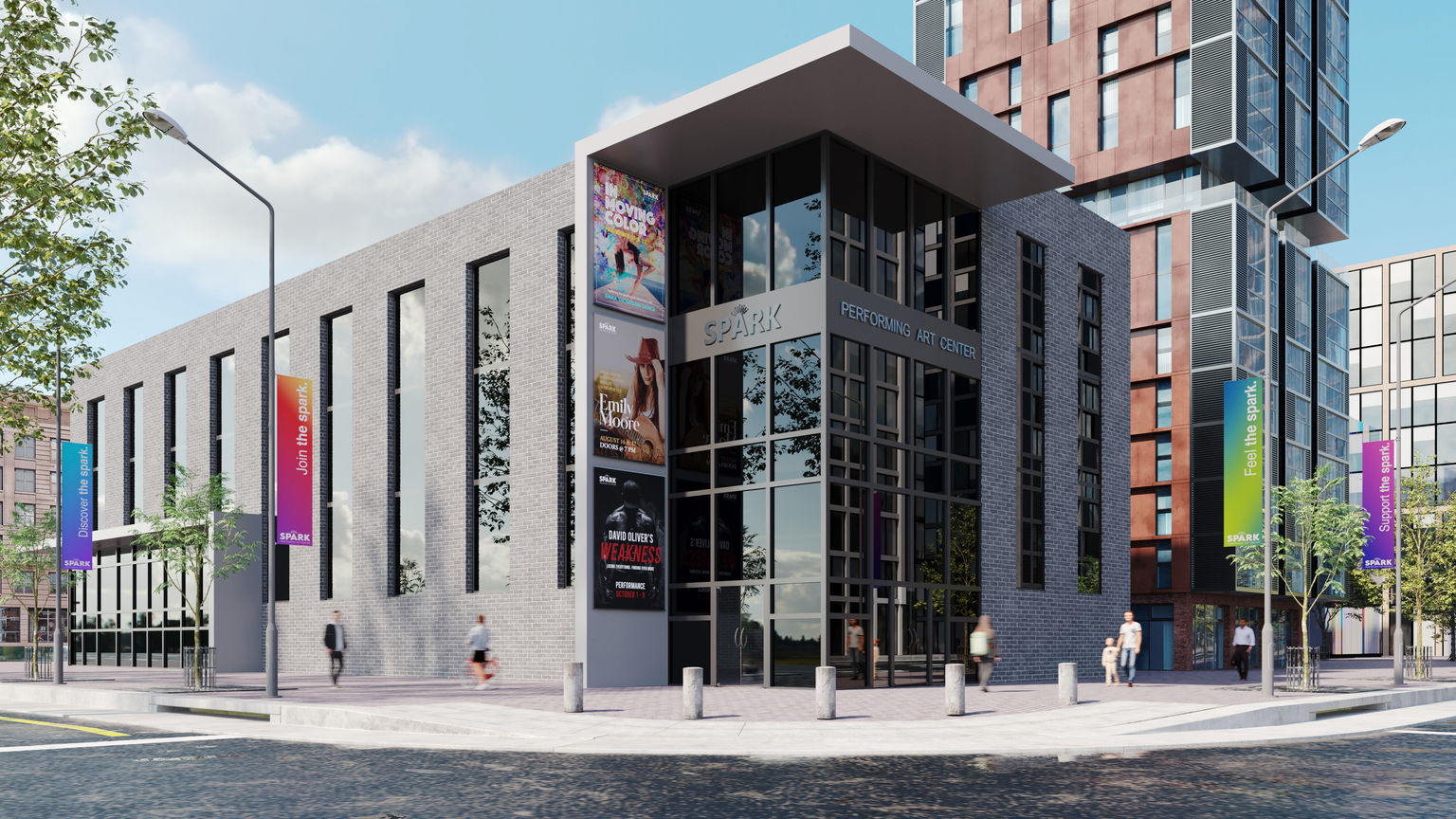 A performing arts building decorated with colorful on-building graphics and multiple pole banners lining the exterior.