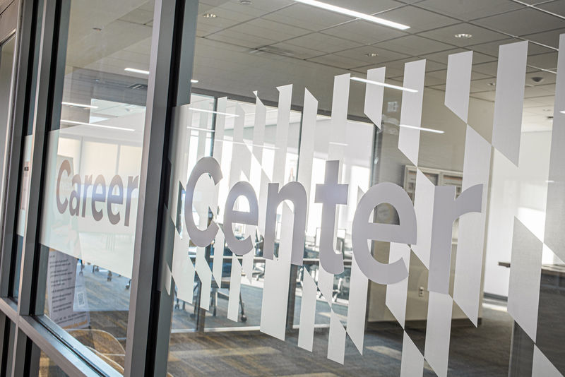 Detail photo of custom Amplify window film applied to the glass wall of a college career center.