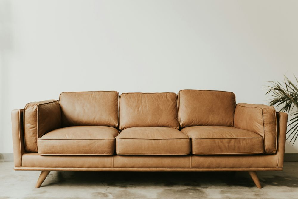 Pottery Barn slipcovered sofa with layered throws and baskets