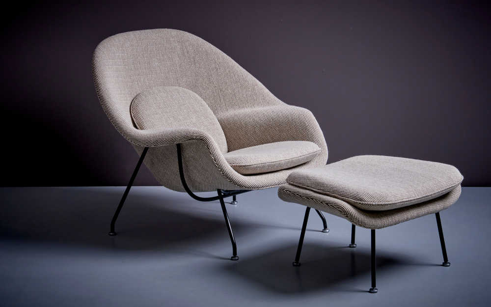 Eero Saarinen's Womb Chair, cocoon-like sanctuary for relaxation.